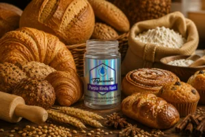 Frasco de terpenos Purple Hindu Kush de Terpenoteca junto a panes artesanales, croissants, bollería y harina para aplicaciones en panificación.